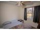 Bedroom featuring a ceiling fan and window with drapes at 4911 Baker Plantation Way, Acworth, GA 30101