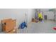 Unfinished basement area with tiled flooring, exercise equipment, and ample storage at 1100 Parkside Ln, Mcdonough, GA 30253