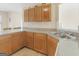 The kitchen boasts ample wood cabinets, countertops, and a stainless steel sink at 1100 Parkside Ln, Mcdonough, GA 30253