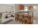 View from kitchen featuring breakfast bar seating and adjoining dining area at 1100 Parkside Ln, Mcdonough, GA 30253