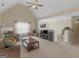 Open-concept living area with high ceilings, neutral tones, carpet flooring, and abundant natural light at 1100 Parkside Ln, Mcdonough, GA 30253