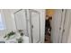 Bathroom with glass shower with large tub and walk-in closet with shelving for storage and organization at 255 Squire Ln, Fayetteville, GA 30214
