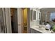Bright bathroom featuring a white vanity, mirror cabinets and a toilet in a separate room at 255 Squire Ln, Fayetteville, GA 30214