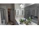 Bright bathroom with vanity, a large mirror, and glass enclosed shower and tub that provides a relaxing space at 255 Squire Ln, Fayetteville, GA 30214