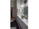 Bathroom with a double vanity, tile flooring, and plenty of storage space for optimal organization at 255 Squire Ln, Fayetteville, GA 30214