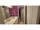 Bathroom features double vanity, white cabinets, and ample lighting fixtures at 255 Squire Ln, Fayetteville, GA 30214