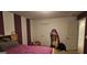 Bedroom featuring purple, white accents, carpeted floors and natural lighting at 255 Squire Ln, Fayetteville, GA 30214