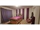 A bedroom featuring purple, white accents, carpeted floors and natural lighting at 255 Squire Ln, Fayetteville, GA 30214