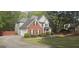 Home exterior showing brick and siding, garage, and landscaped yard in a suburban setting at 255 Squire Ln, Fayetteville, GA 30214
