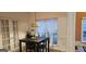 Inviting kitchen nook with a stylish table, pendant lighting, and a serene view through sheer curtains at 255 Squire Ln, Fayetteville, GA 30214