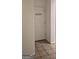 Shot of the laundry room door, featuring tiled flooring and a clear sign indicating its location at 255 Squire Ln, Fayetteville, GA 30214