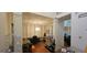 Spacious living room with hardwood floors, contemporary lighting, and open access to other areas at 255 Squire Ln, Fayetteville, GA 30214