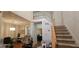 Open concept living area with staircase, and decorative accents at 255 Squire Ln, Fayetteville, GA 30214