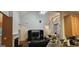 Spacious living room with high ceilings, fireplace, and open floor plan to kitchen and dining area at 255 Squire Ln, Fayetteville, GA 30214