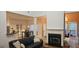 Bright living room with a fireplace, hardwood floors, and open layout to the kitchen and dining area at 255 Squire Ln, Fayetteville, GA 30214