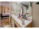 Bathroom with vanity, decorative accents, and a view into the bedroom at 178 Norman Rd, Covington, GA 30014