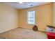 Bedroom featuring a window, carpet flooring, and neutral-colored walls at 178 Norman Rd, Covington, GA 30014