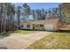 Ranch-style home with a quaint porch and a long driveway for easy parking at 178 Norman Rd, Covington, GA 30014