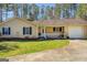 Attractive front exterior with a cozy porch and a manicured lawn at 178 Norman Rd, Covington, GA 30014