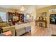 Spacious open-concept living area with wood flooring, dining area, and an entertainment center, great for entertaining at 178 Norman Rd, Covington, GA 30014