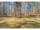 Large lot featuring mature trees and natural landscaping at 178 Norman Rd, Covington, GA 30014