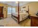 Bedroom showcasing a four-poster bed, vaulted ceilings, and bright natural light at 178 Norman Rd, Covington, GA 30014