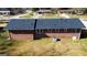 An aerial back view of the home with a brick exterior and well-kept lawn at 6268 Mount Zion Blvd, Morrow, GA 30260