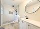 Modern bathroom features a tiled shower with glass door and dual vanity with sleek fixtures at 6268 Mount Zion Blvd, Morrow, GA 30260