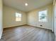 Bright, airy bedroom with two large windows and modern wood-look flooring at 6268 Mount Zion Blvd, Morrow, GA 30260