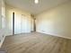 Empty bedroom featuring light-colored walls, wood-look floors, and a closet with sliding doors at 6268 Mount Zion Blvd, Morrow, GA 30260
