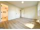 Spacious bedroom with light hardwood floors and an ensuite bathroom with tiled shower stall at 6268 Mount Zion Blvd, Morrow, GA 30260