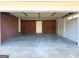 Clean garage with ample space, brick wall and white door, ready for parking and storage at 6268 Mount Zion Blvd, Morrow, GA 30260