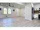 An open-concept living room with modern floors and neutral walls at 6268 Mount Zion Blvd, Morrow, GA 30260