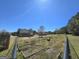 Fenced backyard with a garden, offering privacy and outdoor living at 1441 Henderson Ridge Ln, Loganville, GA 30052
