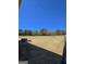 Large backyard featuring a fence, trees, and plenty of open space for outdoor enjoyment at 1441 Henderson Ridge Ln, Loganville, GA 30052