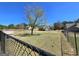 Spacious backyard with a tree, fence, and ample space for outdoor activities at 1441 Henderson Ridge Ln, Loganville, GA 30052