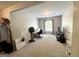 Bedroom area with window, fan, TV and desk, offering a versatile space at 1441 Henderson Ridge Ln, Loganville, GA 30052