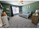 Well-lit bedroom boasts a white wooden bed, natural light, and shelving for books and toys at 1441 Henderson Ridge Ln, Loganville, GA 30052