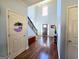 Spacious foyer with hardwood floors, staircase, and ample natural light at 1441 Henderson Ridge Ln, Loganville, GA 30052