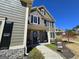 Inviting entrance with a blue front door, stone accents, and decorative wreath at 1441 Henderson Ridge Ln, Loganville, GA 30052