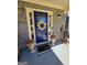 Close-up of the blue front door featuring a floral wreath and welcoming decor at 1441 Henderson Ridge Ln, Loganville, GA 30052