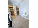 Hallway with a view of the laundry room and Primary bedroom, connecting different living spaces at 1441 Henderson Ridge Ln, Loganville, GA 30052