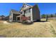 Side view of the property showing the neutral siding, stone accents, and landscaping at 1441 Henderson Ridge Ln, Loganville, GA 30052