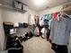 Organized walk-in closet with clothes and shoe racks for ample storage at 1441 Henderson Ridge Ln, Loganville, GA 30052