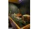 Home wet bar with a wood barrel, assorted bottles, and an elegant countertop at 1441 Henderson Ridge Ln, Loganville, GA 30052
