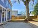 Home exterior with a large tree in the backyard, complemented by a wooden fence for privacy at 721 Cascade Sw Ave, Atlanta, GA 30310