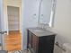 Bathroom featuring a modern vanity, granite countertop, and stylish geometric tile floor at 721 Cascade Sw Ave, Atlanta, GA 30310