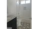 Bathroom with a tile floor, granite counter, and shower-tub combo with stylish tile accents at 721 Cascade Sw Ave, Atlanta, GA 30310
