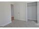 Neutral bedroom features carpet, a closet, and doors leading to additional rooms at 721 Cascade Sw Ave, Atlanta, GA 30310
