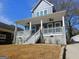 Attractive two-story home featuring a spacious front porch with stylish ceiling fans at 721 Cascade Sw Ave, Atlanta, GA 30310